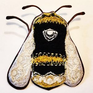 Big embroidered bee with copper body